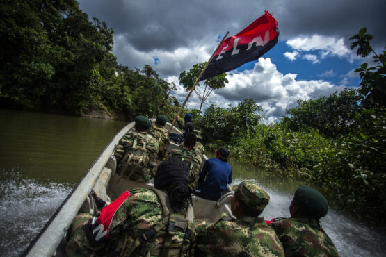 ELN guerrillas patrol a river. Image: Bloomberg 